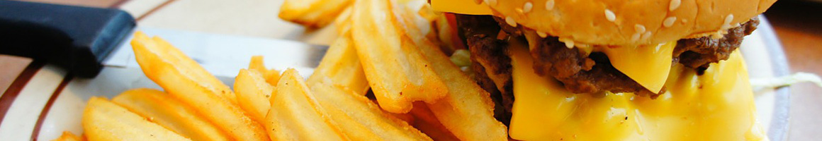 Eating Burger Fast Food at Griffs Hamburgers restaurant in Albuquerque, NM.